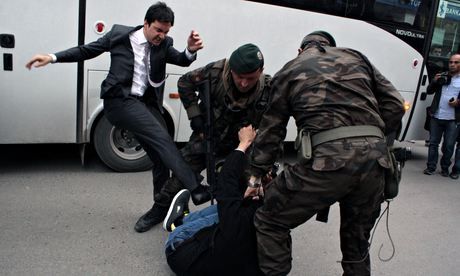 Yusuf-Yerkel-kicks-a-protester.jpg